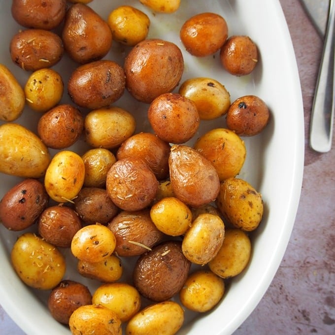 pressure cooker roasted potatoes in a white dish