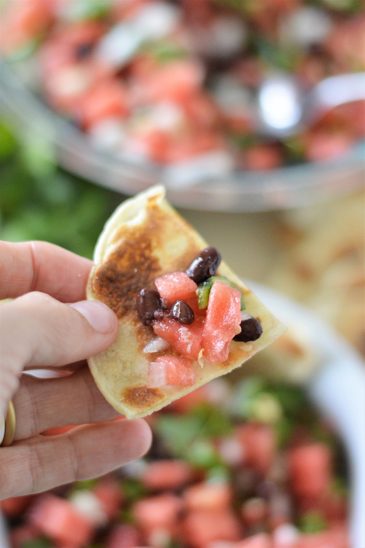 dipping pita chips in fruit salsa