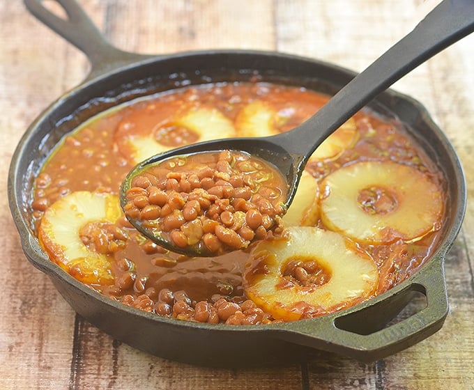 Serve up a generous spoonful of these bourbon baked beans with bacon and pineapples at your next barbecue. 