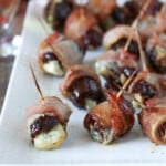 Brown Sugar Devils on Horseback on a white serving platter