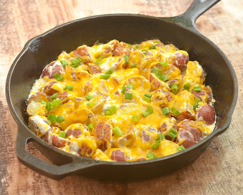 Cheddar Ranch Potatoes with rose potatoes, Ranch seasoning, sour cream, and cheddar. Creamy, cheesy, and a breeze to make with simple ingredients, they may very well be the best potato side dish ever!