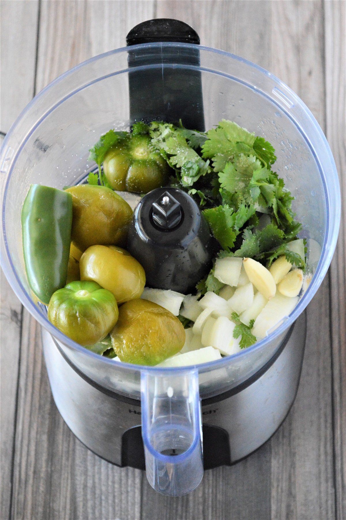 boiled tomatillo, jalapeno, onions, garlic, cilantro in a food processor