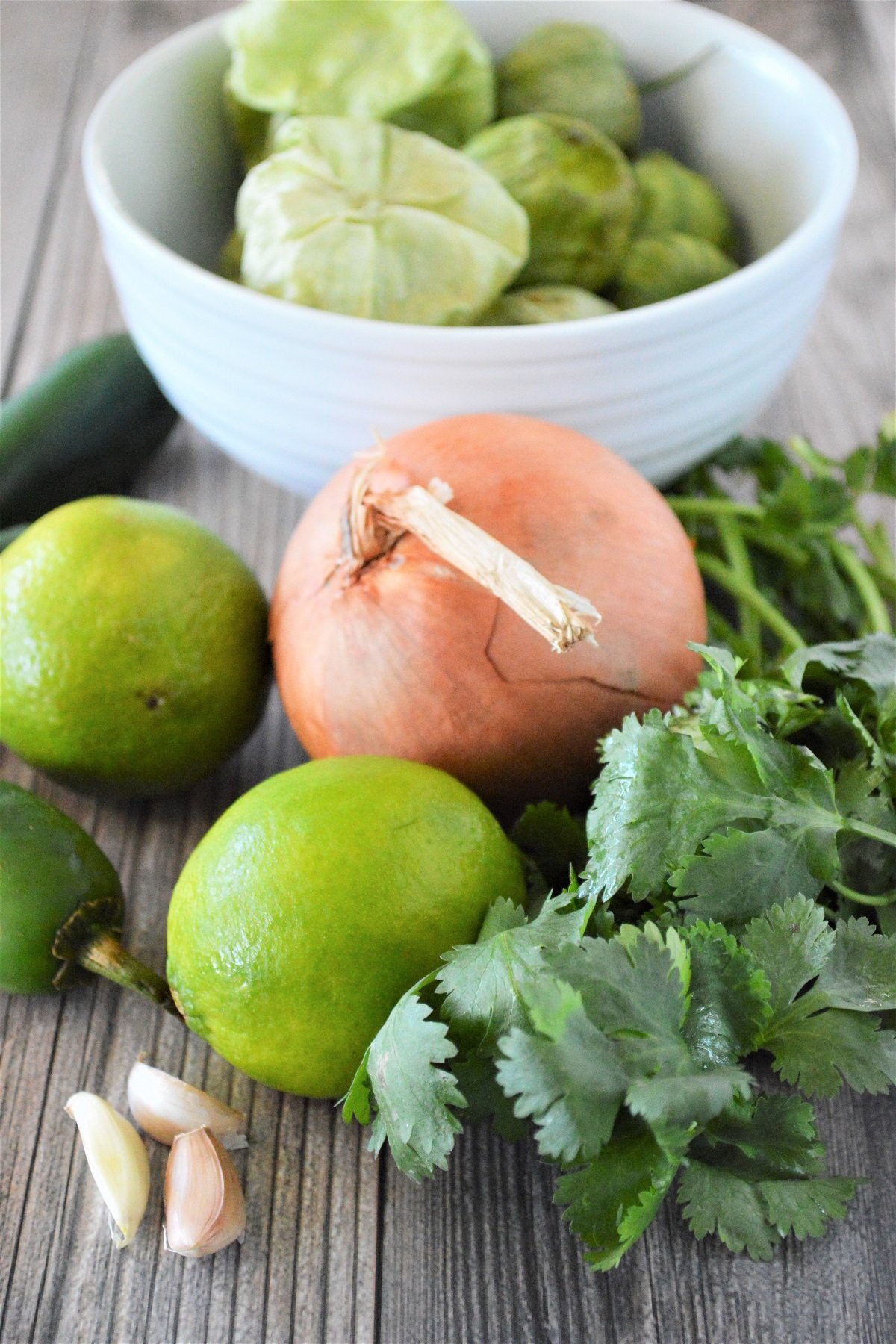 tomatillos, jalapenos, onion, cilantro, garlic, limes