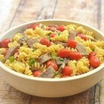 pasta salad with Mongolian beef, tomatoes, green onions