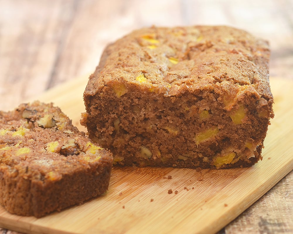 Peach Bread Loaf deliciously studded with fresh peach bits and bursting with warm cinnamon flavors. Super soft and moist, it's amazing for breakfast or anytime snack.