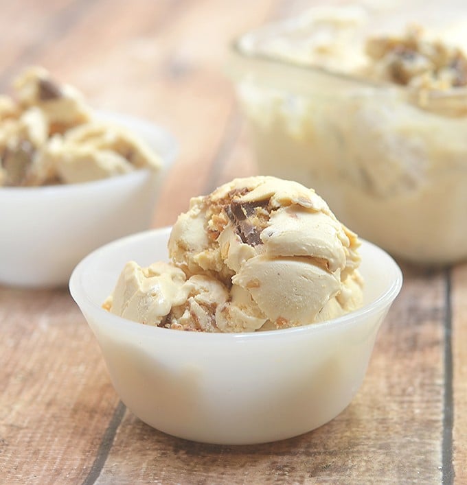 Double Peanut Butter Ice Cream with chunks of Reese's peanut butter cups in a rich peanut butter ice cream. So easy to make with only 4 ingredients and no churn or ice cream maker needed!