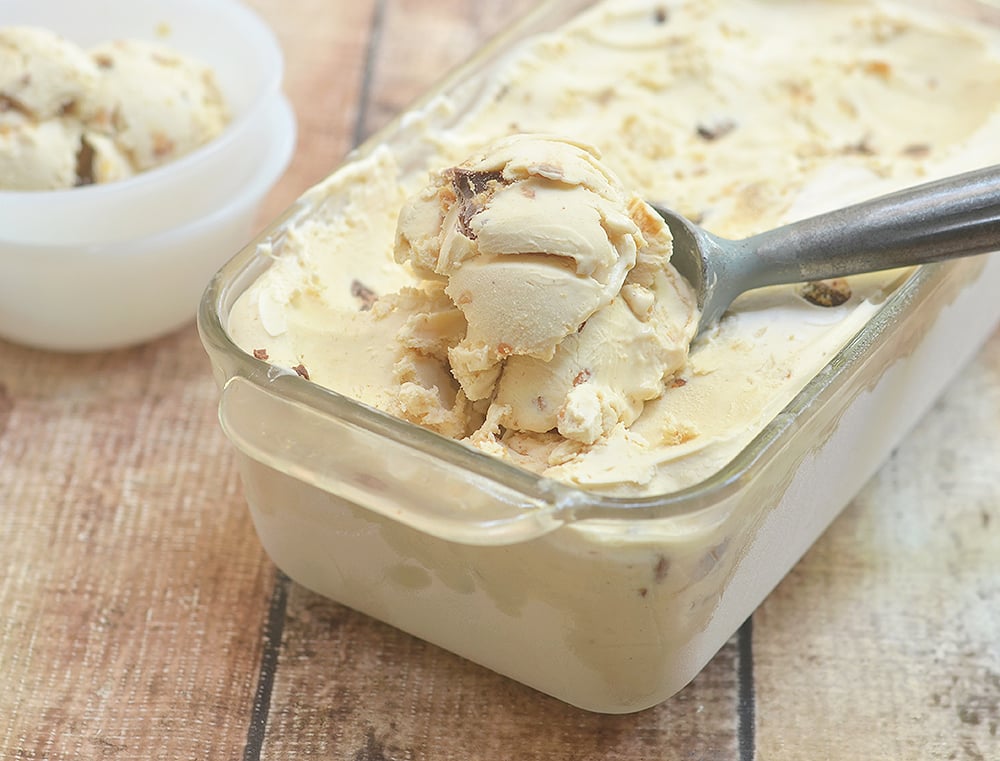 Serve up a scoop of this yummy double peanut butter ice cream with chunks of Reese's peanut butter cups. So easy to make with only 4 ingredients and no churn or ice cream maker needed!