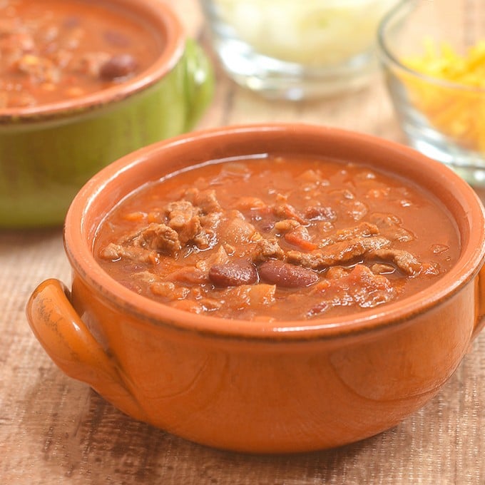 Cowboy Steak Chili with diced beef and tender beans in a smoky, chili-spiced tomato gravy is the ultimate chilly day food. Serve with cornbread for a hearty dinner or set out with various fixings for DIY game day eats!