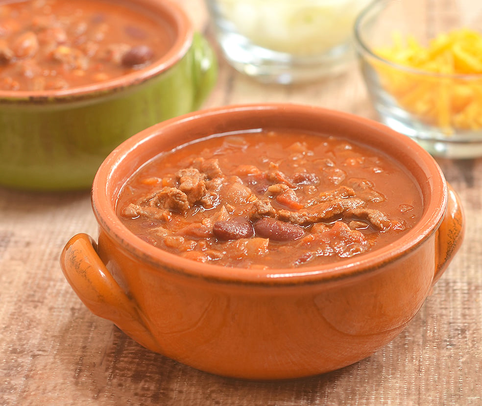 Cowboy Steak Chili with diced beef and tender beans in a smoky, chili-spiced tomato gravy is the ultimate chilly day food. Serve with cornbread for a hearty dinner or set out with various fixings for DIY game day eats!!