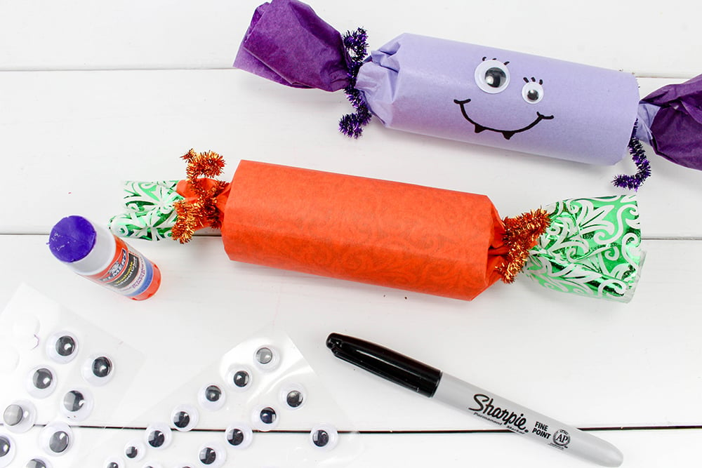 Halloween Party Poppers-glue googly eyes and draw mouths-are sure to take your trick or treat game to a whole new fun. Filled with candies and other goodies, they're the ultimate Halloween party favors!