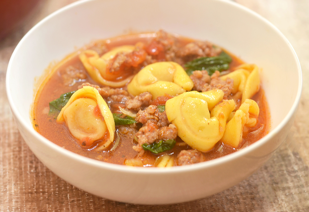 spicy Italian sausage, cheese tortellini, and baby spinach makes this soup a rich and hearty meal for a cold winter day