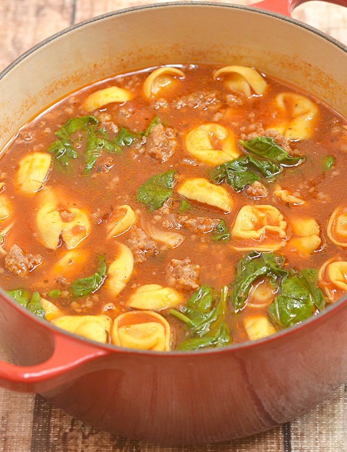 Sausage Tortellini Soup chockful of spicy Italian sausage, cheese tortellini, and baby spinach is hearty, delicious, and the perfect meal for chilly weather. Quick and easy to make and cooks in one pot!
