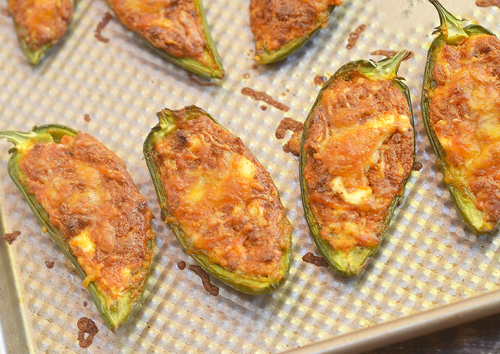 Chorizo-Stuffed Jalapeno Poppers filled with chorizo, cream cheese, and shredded Mexican cheese blend are the perfect game day eats! They're smoky, spicy, creamy and full of bold flavors you'll love in an appetizer!!