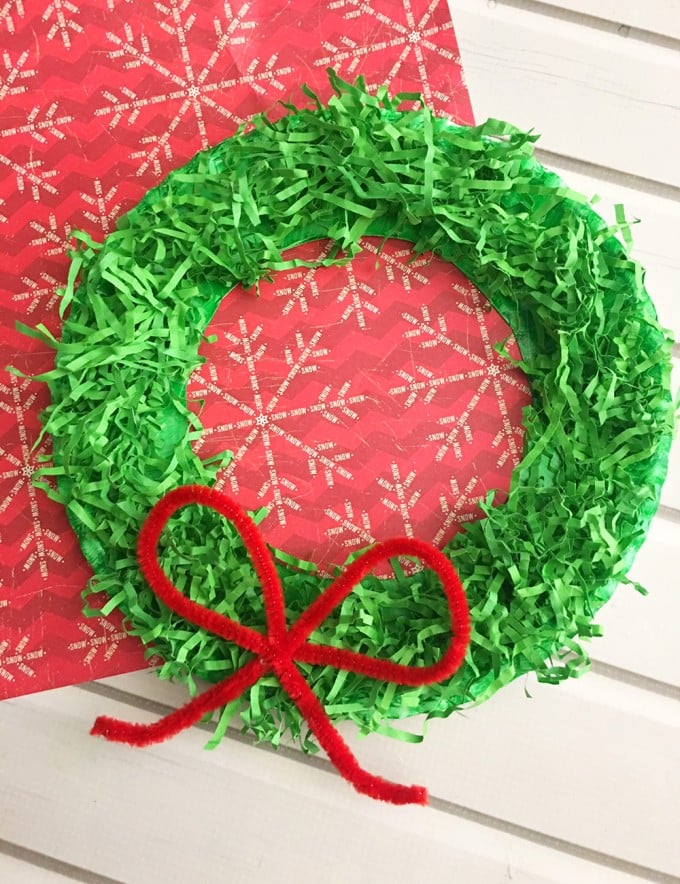 DIY Paper Christmas Wreath is a fun paper craft to do with the whole family. It's inexpensive to make and adds a festive touch to your holiday decor.