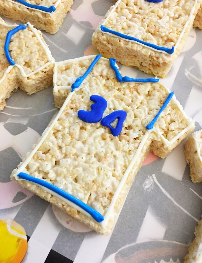 Sports Jersey Rice Krispies Treats are the perfect dessert or snack for a game day party. They're as much fun to make as they are to eat-draw details on the jerseys using blue frosting
