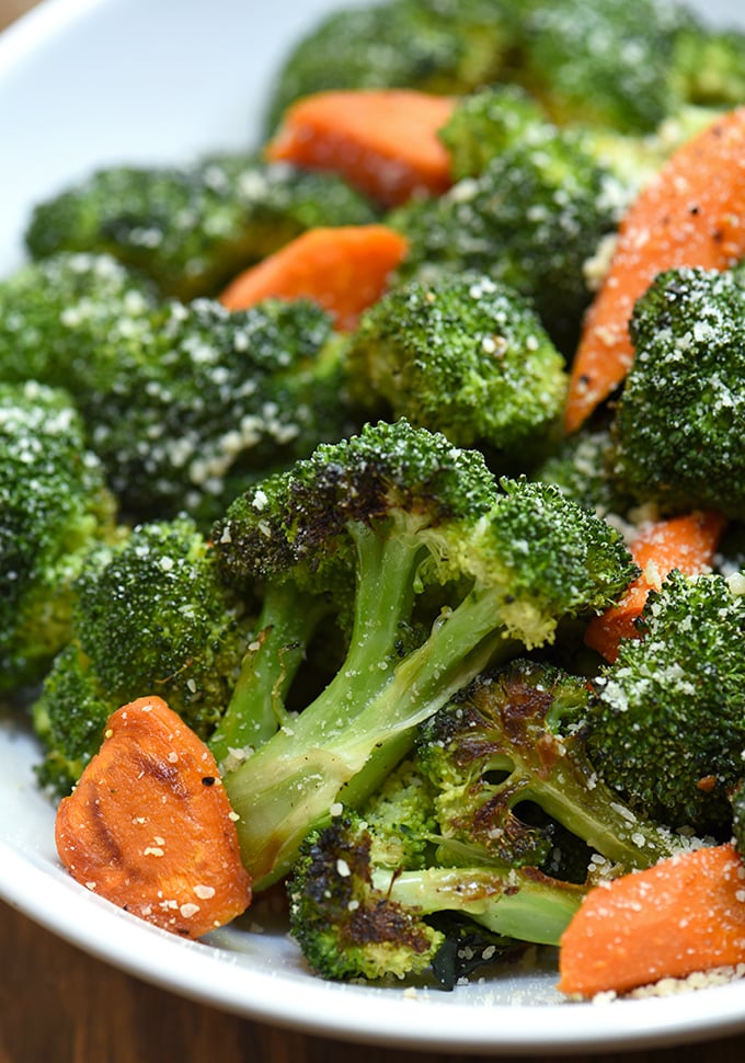 Oven-Roasted Broccoli and Carrots with garlic, Parmesan, and lemon zest on a serving plate