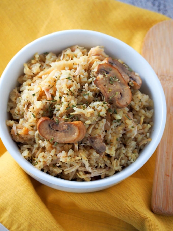 Instant pot chicken and rice with mushrooms in a white bowl