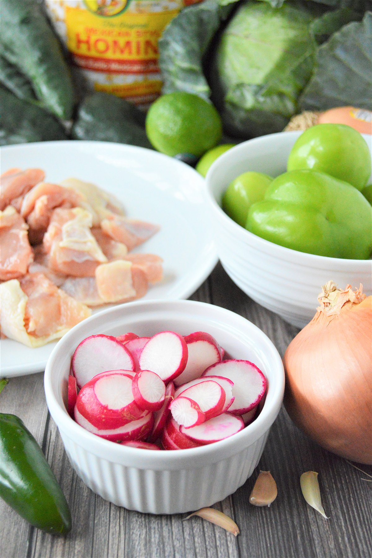 chicken, tomatillos, onion, chili pasilla, radish, cabbage, garlic, can of hominy