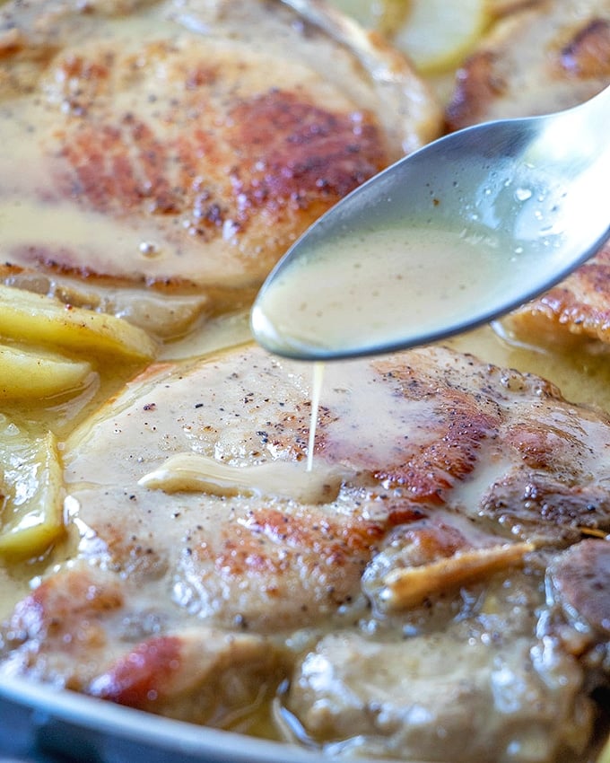 Caramel Baked Pork Chops with apples are ready in an hour and in one pan. A delicious medley of sweet and savory flavors, they're amazing over steamed rice, mashed potatoes, or noodles.