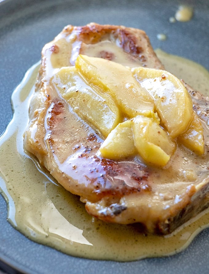 Baked Pork Chops with tart apples and citrusy caramel sauce are a delicious medley of sweet and savory tastes you'll love. Serve with steamed rice, mashed potatoes or noodles for dinner meal everyone will be fighting over!