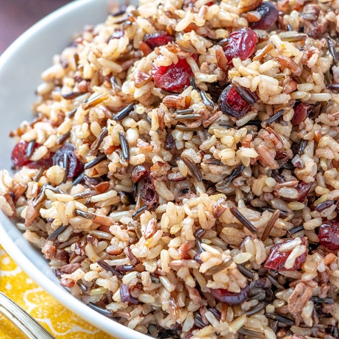 Cranberry Pecan Wild Rice Stuffing in a white serving bowl