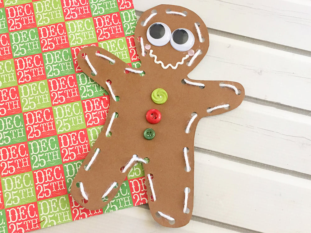 Homemade Card stock paper Gingerbread man ornaments are the perfect holiday project for little hands.