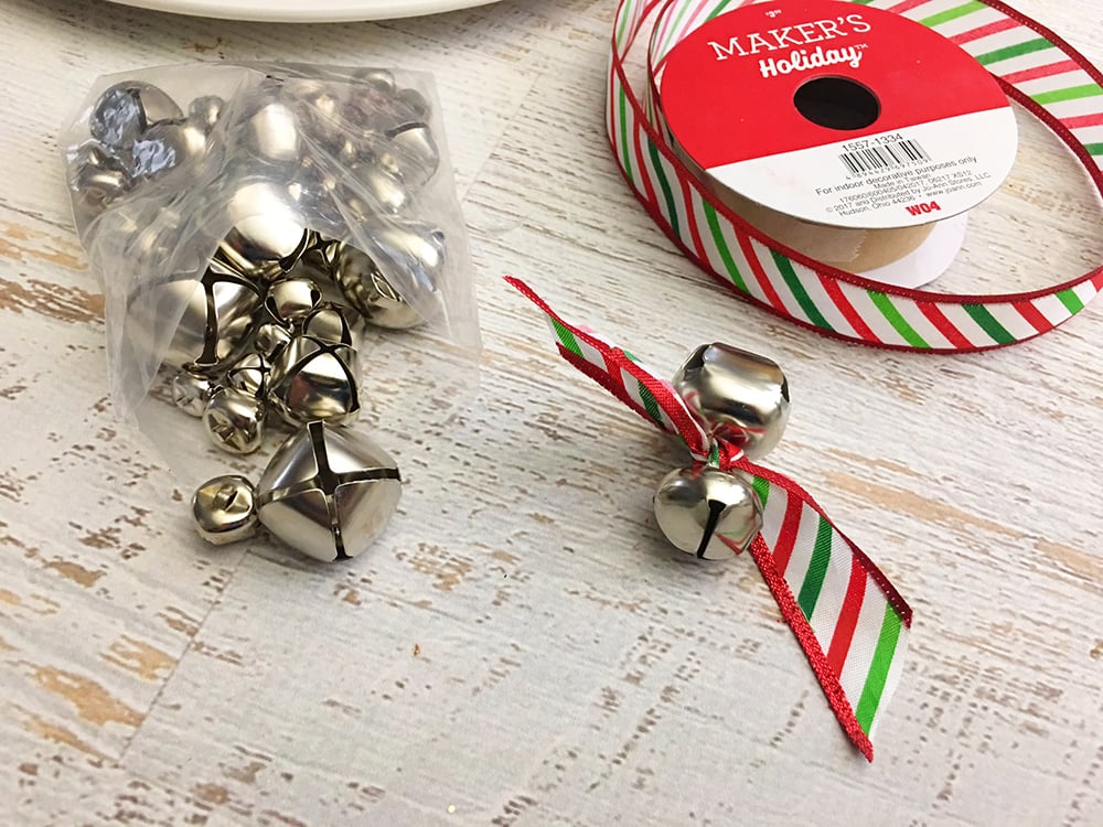 DIY Snowman Decorative Plate - attach two bells with a ribbon and tie into a knot