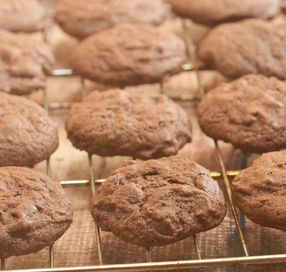 Mrs. Fields Chocolate Cookies cooling on a rack are the perfect baked treat! They're soft, fudgy and chocolatey!