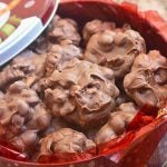 crockpot chocolate peanut candy in red snowman tin