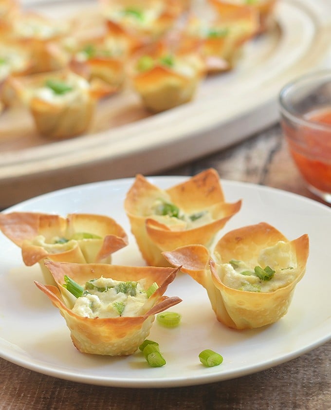 Crab Rangoon Wonton Cups with all the flavors of your favorite Chinese appetizer but baked for less guilt snacking. Crispy, creamy and tasty, they're a guaranteed party hit!