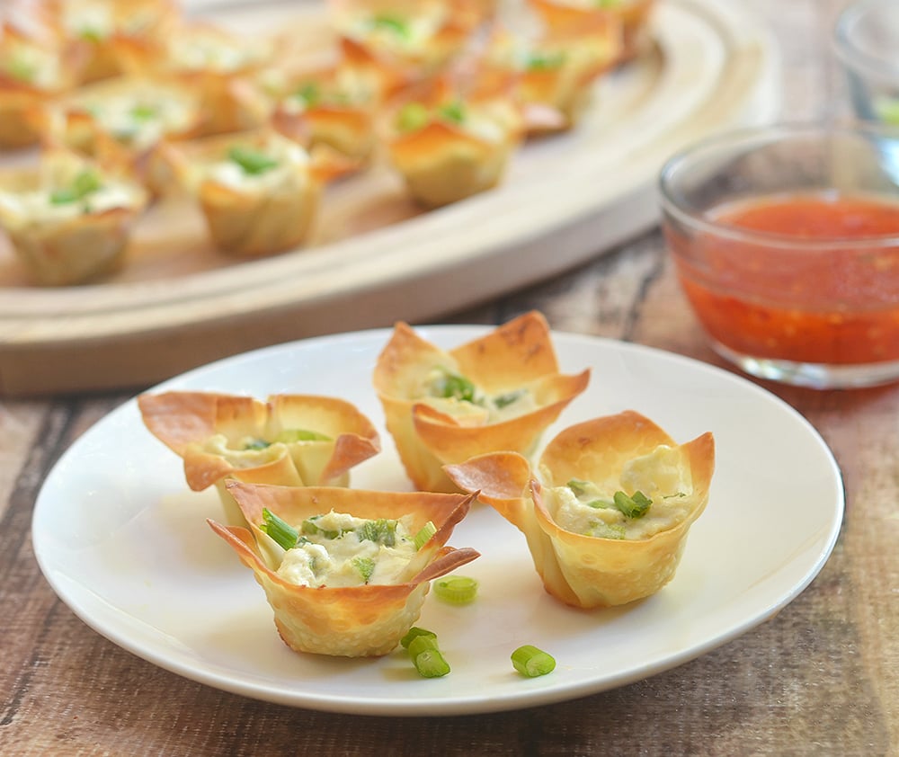 Crab Rangoon Wonton Cups with all the flavors of your favorite Chinese appetizer but baked for less guilt snacking. Crispy, creamy and tasty, they're a guaranteed party hit!