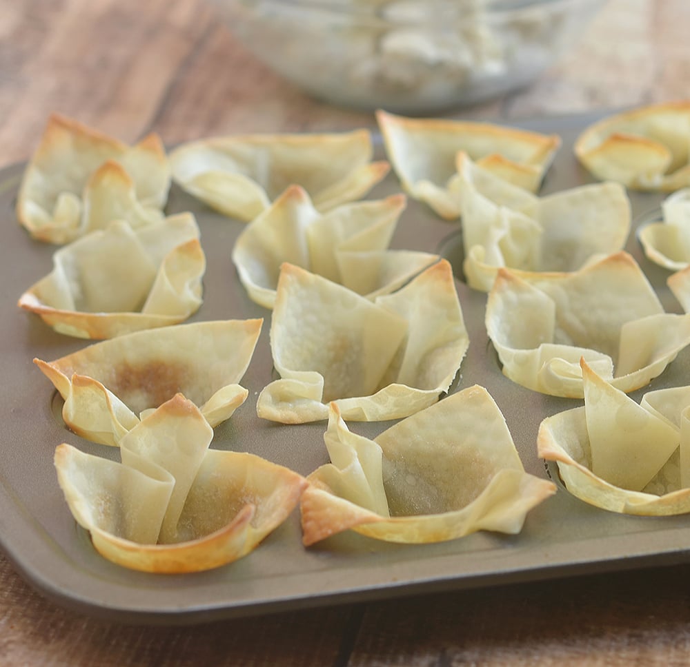 Wontons baked to golden and crisp perfection in muffin tins.