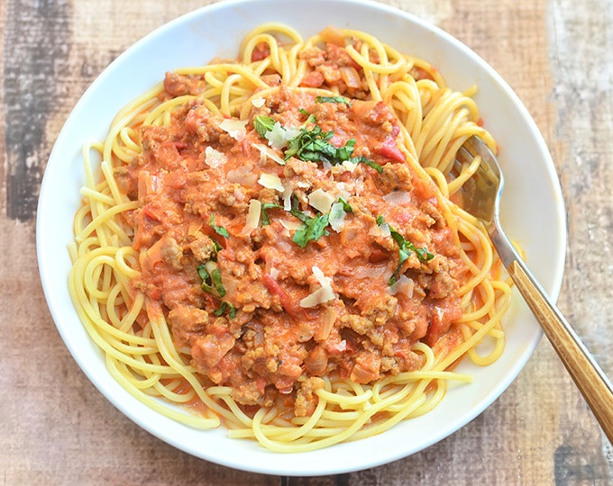 Spaghetti alla Vodka with Italian sausage on a serving plate