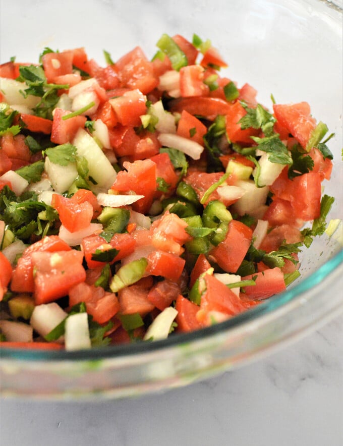 Homemade Pico de Gallo in a clear bowl.