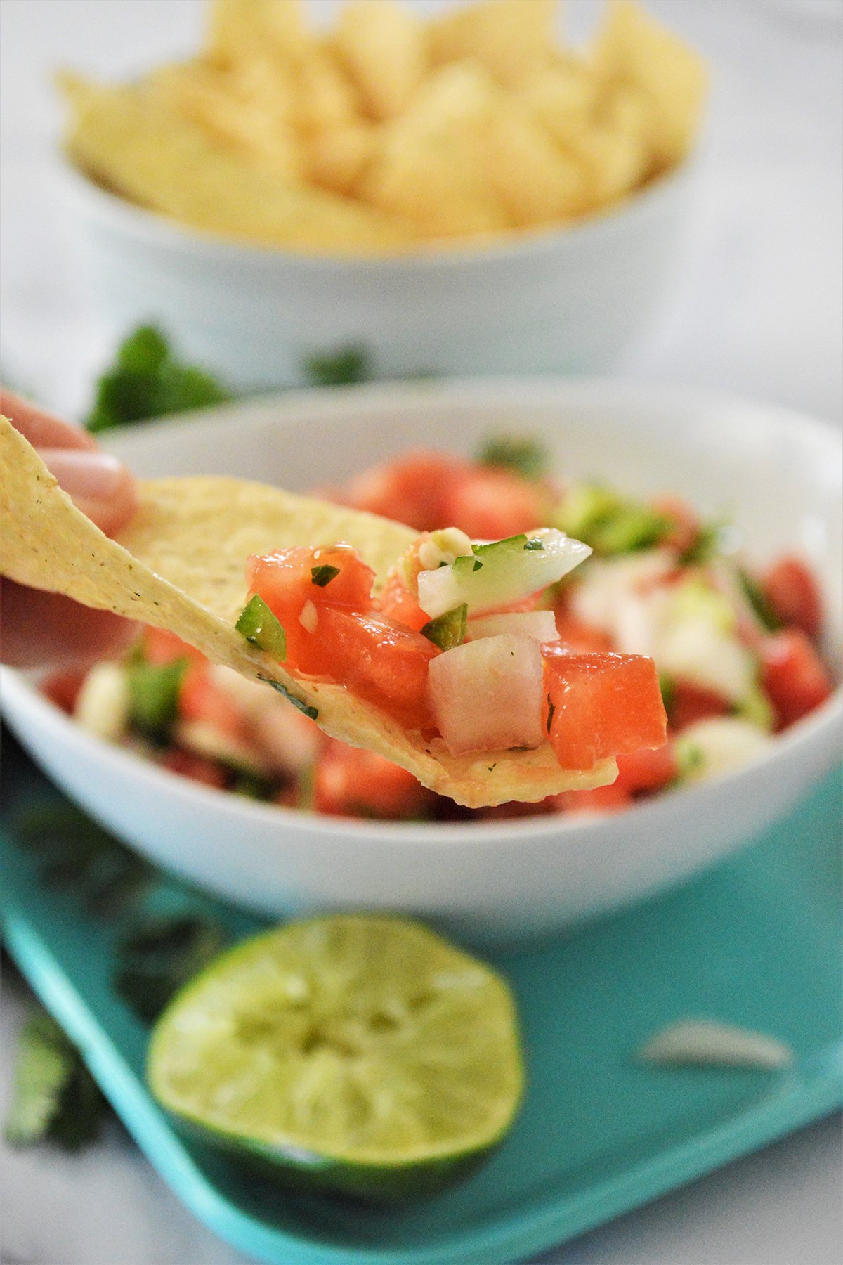 eating chips with pico de gallo