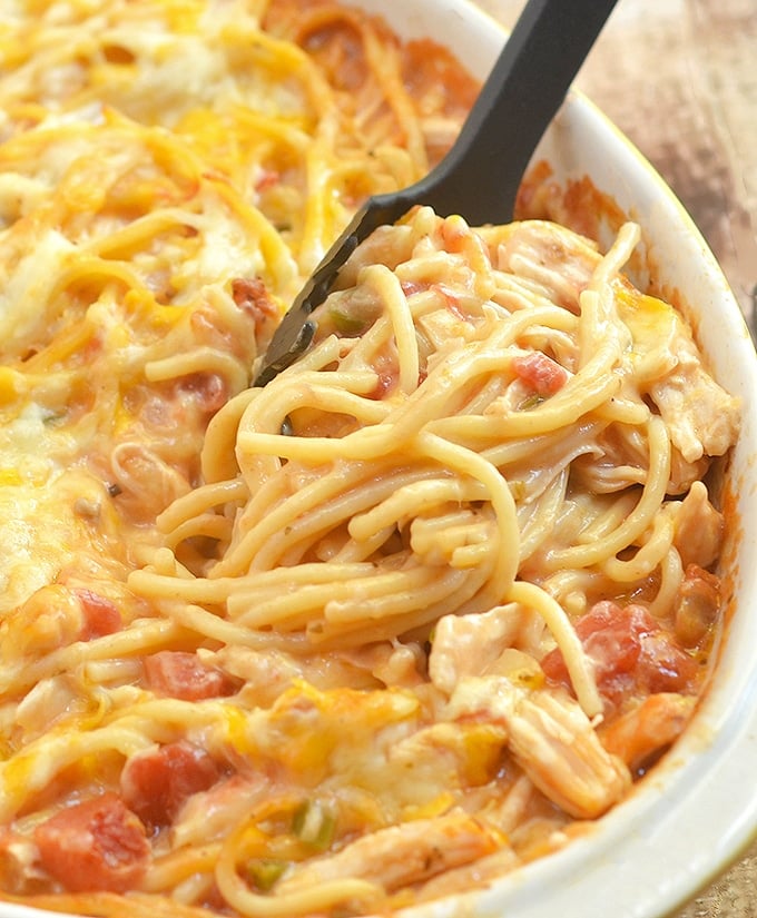 Chicken Spaghetti Casserole loaded with moist chicken, spaghetti noodles, and creamy tomato sauce is the epitome of comfort food. Cheesy, hearty and tasty, it's sure to be a family favorite!
