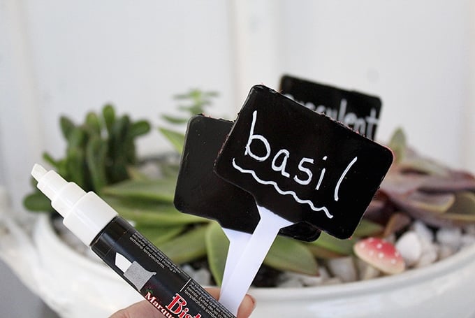 write name of plants on chalkboard herb garden markers