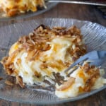 party potatoes with crispy onions topping on a glass plate