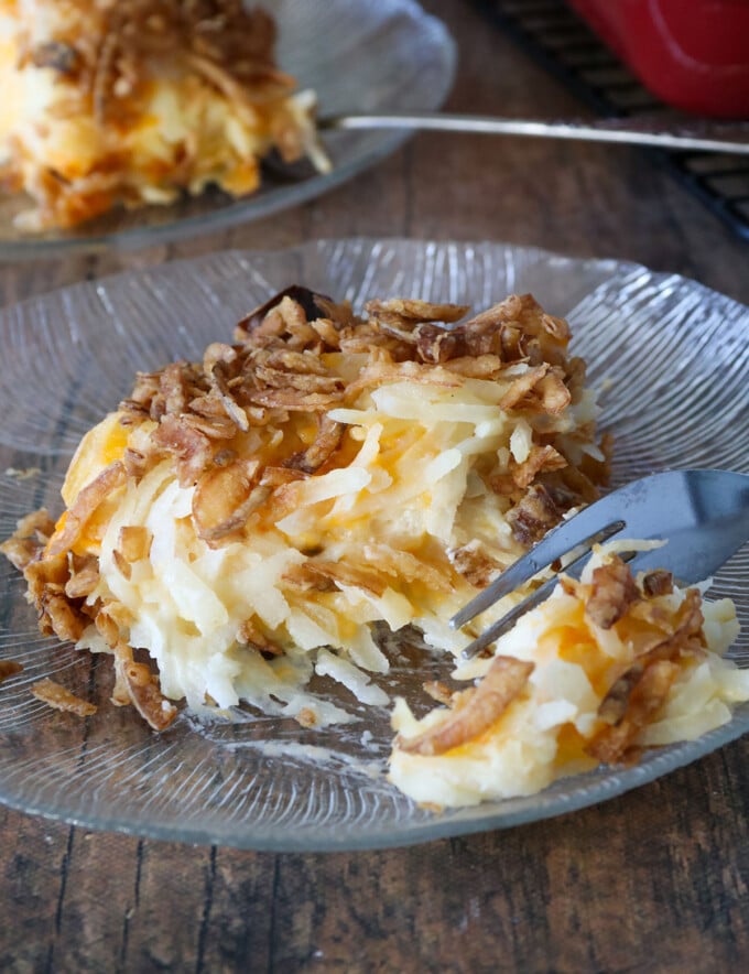 party potatoes with crispy onions topping on a glass plate