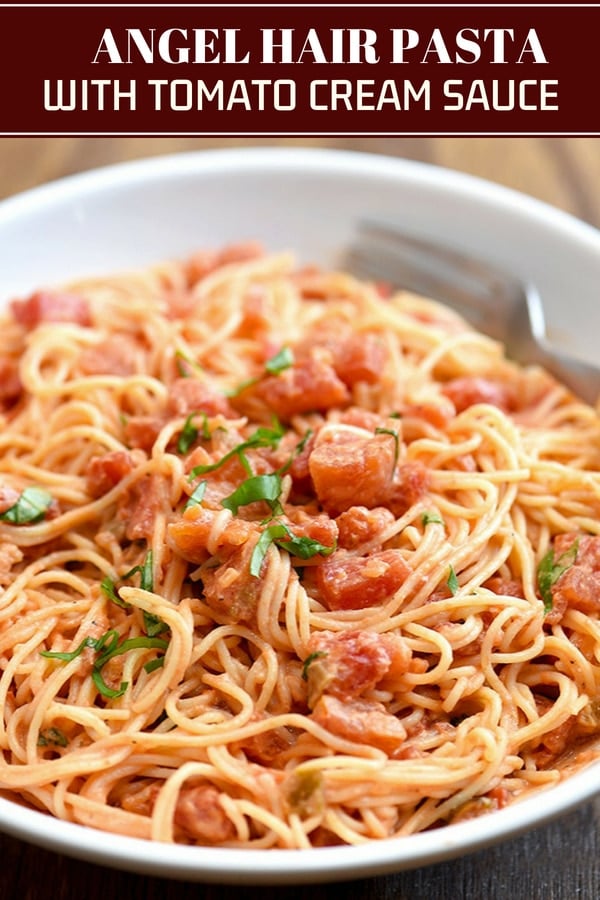 Angel Hair Pasta with Tomato Cream Sauce on a white plate