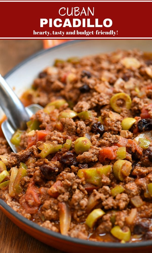 Cuban-style picadillo recipe with green olives, raisins, bell peppers, and tomato sauce in a skillet