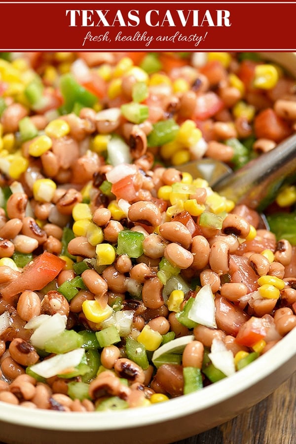 Texas Caviar dip with black-eyed peas, grilled corn, tomatoes, bell peppers, onions, jalapeno, and Italian dressing in a serving bowl