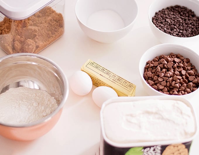 flour, chocolate chips, butter, sugar, eggs, and vanilla ice cream to make chocolate chip cookie ice cream sandwiches