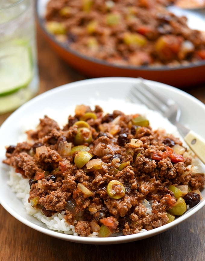 Cuban Beef Picadillo served over rice in a white plate