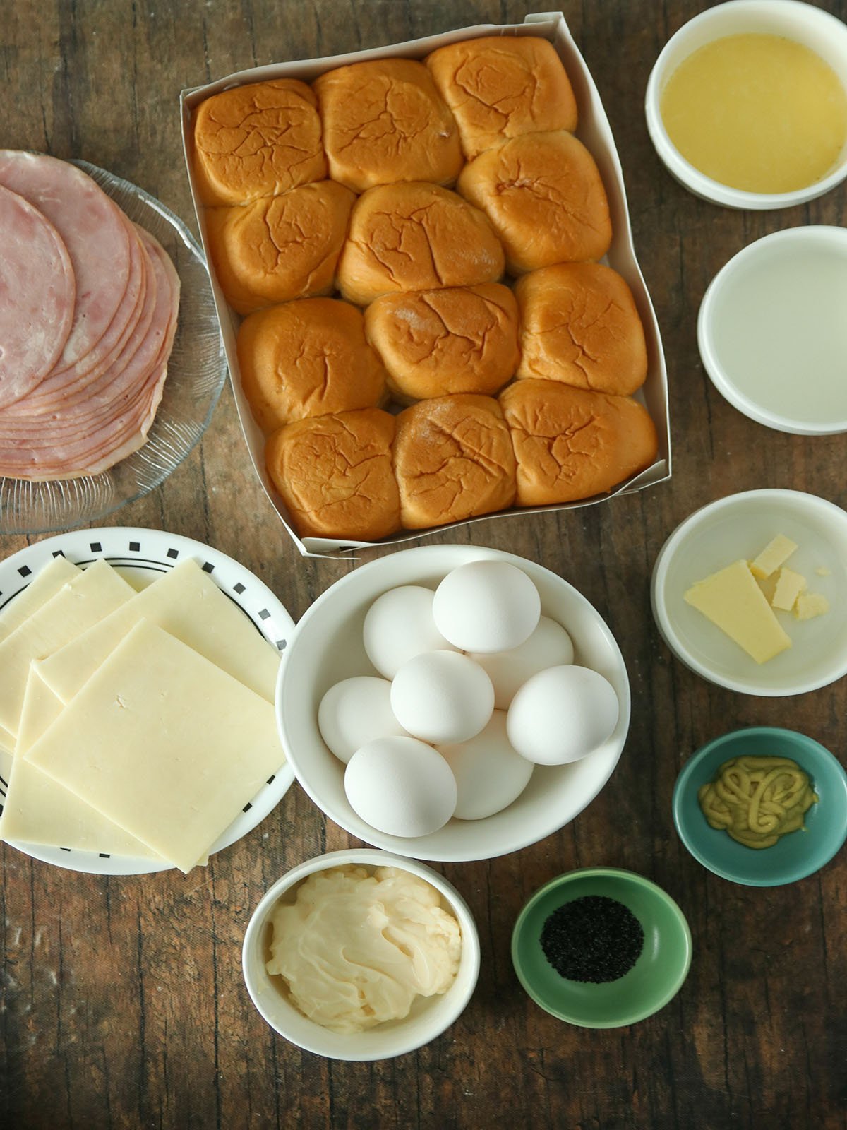 sliced ham, eggs, cheese, poppy seeds, dijon mustard, butter, milk, mayonnaise, bread rolls