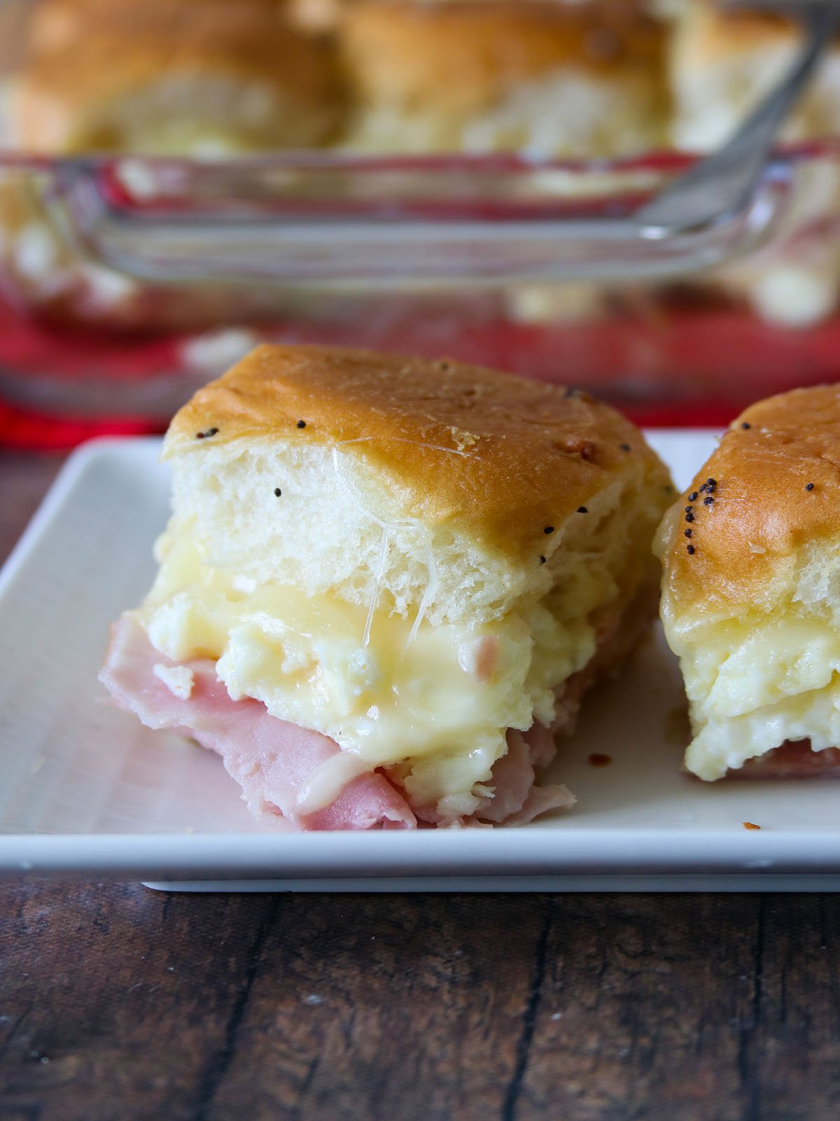 ham egg and cheese breakfast sliders on a white platter