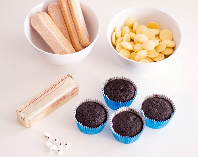 chocolate cupcakes, yellow candy coating, and googly eyes for making Minion Cupcakes