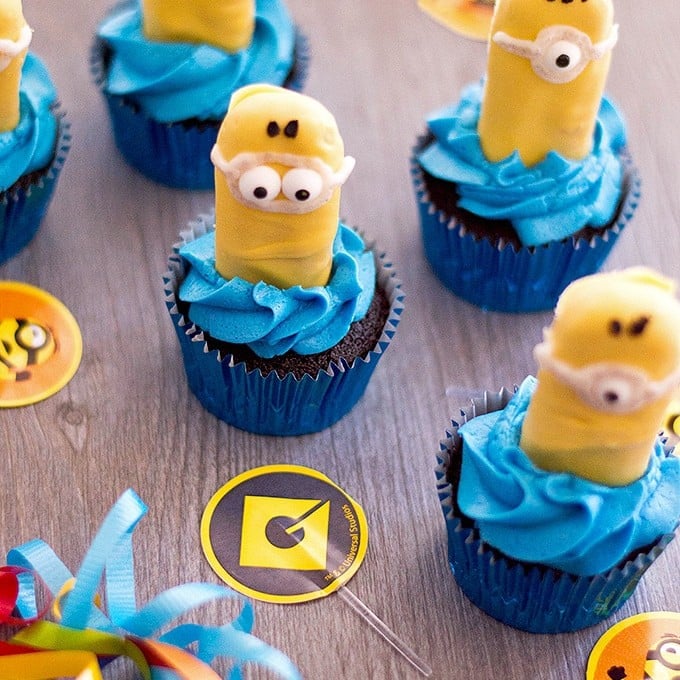 Minion Cupcakes with blue frosting and candy coated ladyfingers