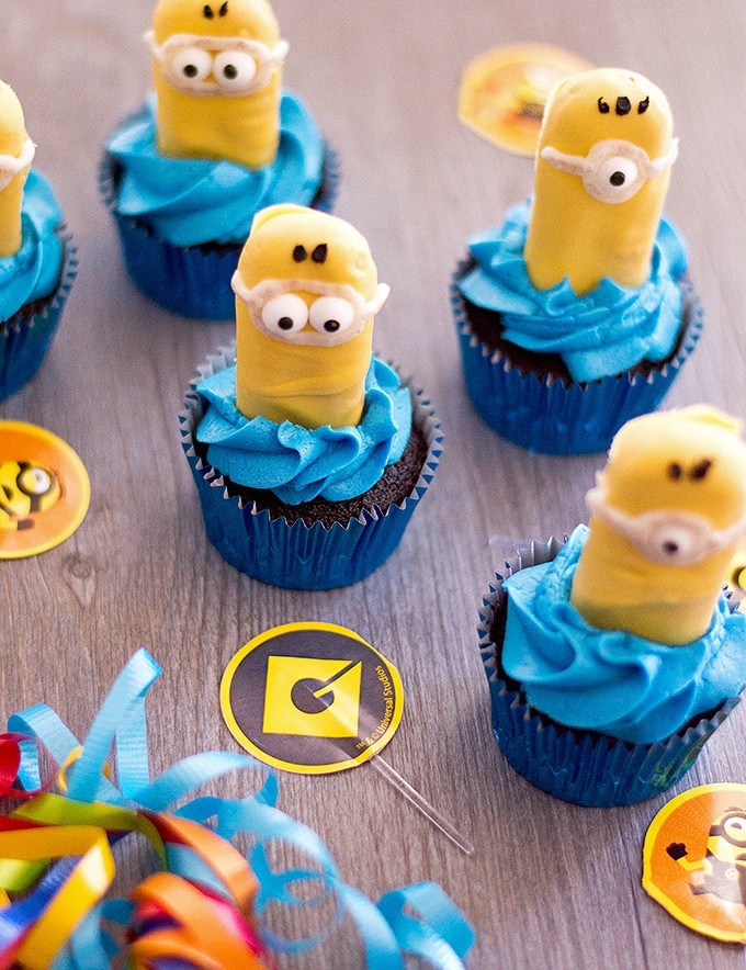 Minion Cupcakes with blue frosting and candy coated ladyfingers