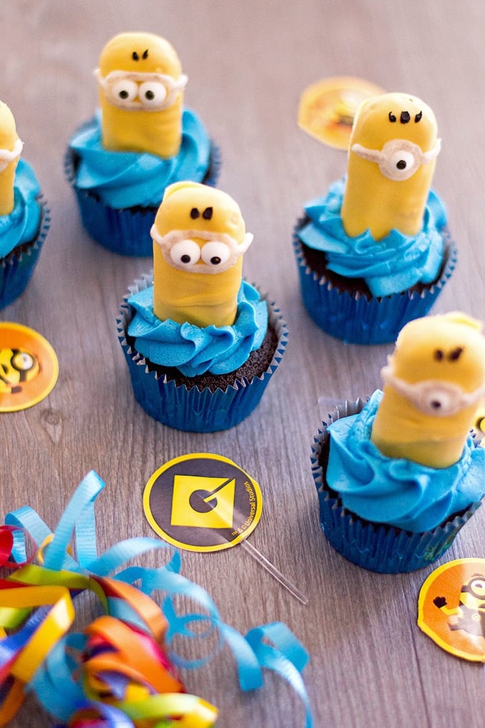 Minion Cupcakes with blue frosting and candy coated ladyfingers